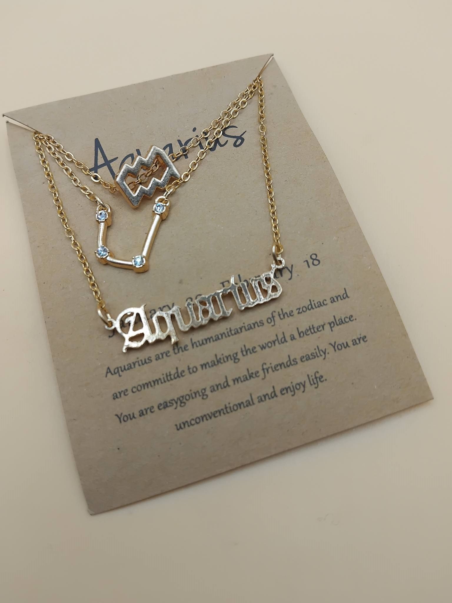 (N4) Triple horoscope necklace set brand new on card