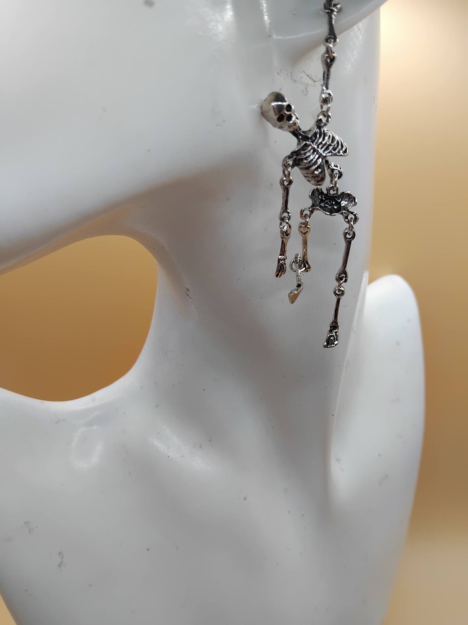 (E12) Dangly skeleton stainless steel boxed Earrings