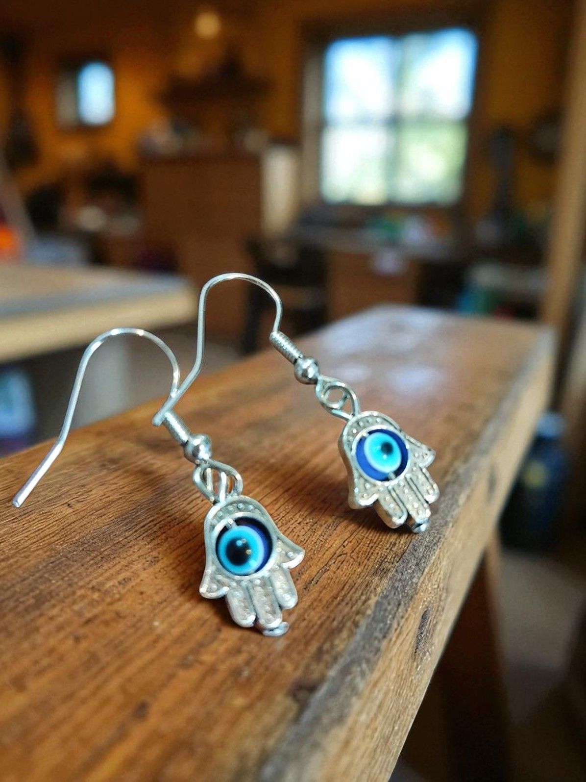 (B-E-2) Rolling goth evil eye in palm earrings boxed