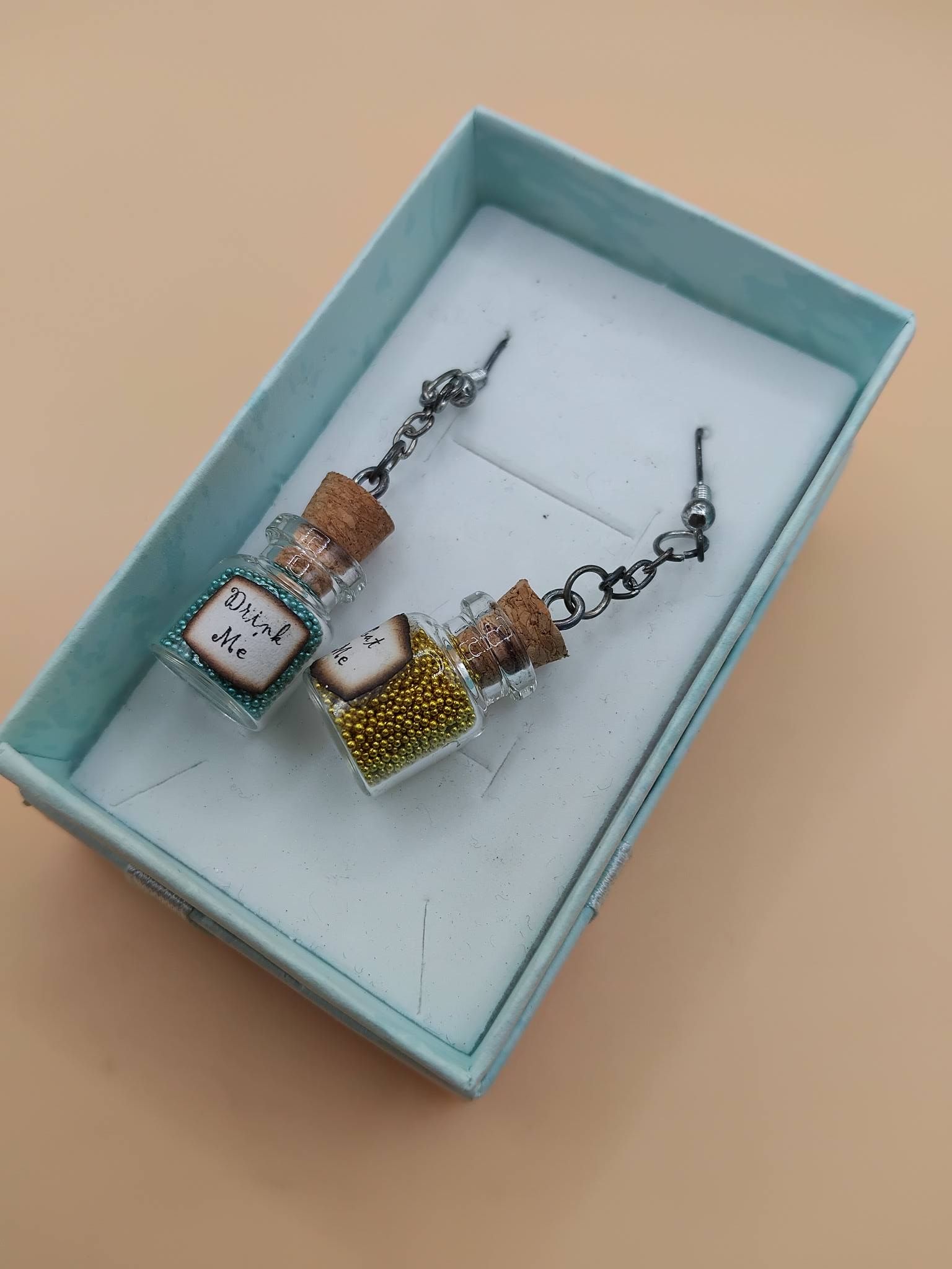 (E18) Fun Eat me and Drink me earrings boxed