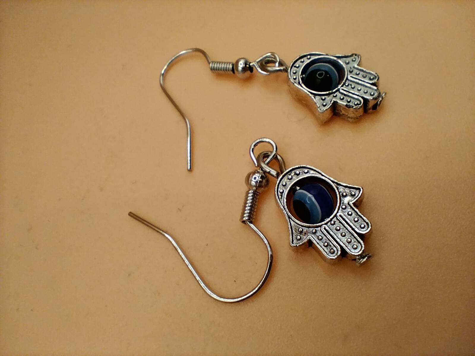(BE2) Rolling goth evil eye in palm earrings boxed
