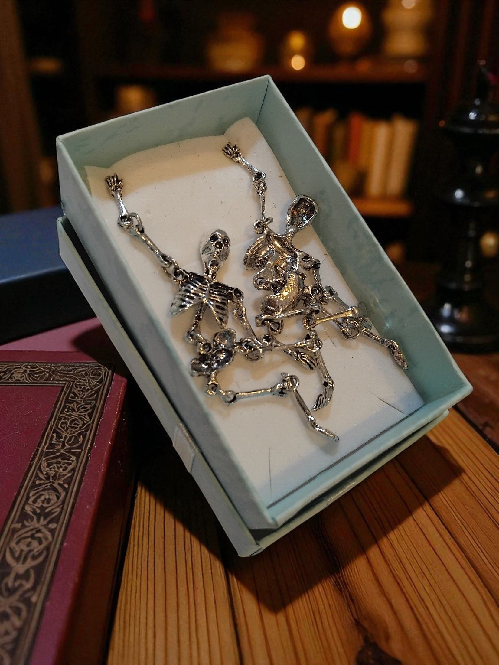(E11) Dangly skeleton stainless steel boxed Earrings