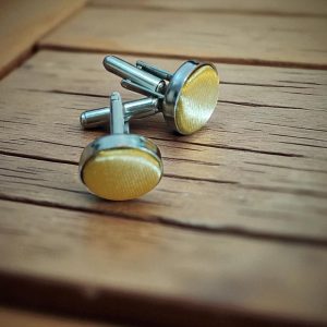 (Cf1) Pair of coloured ceramic on stainless steel boxed cufflinks